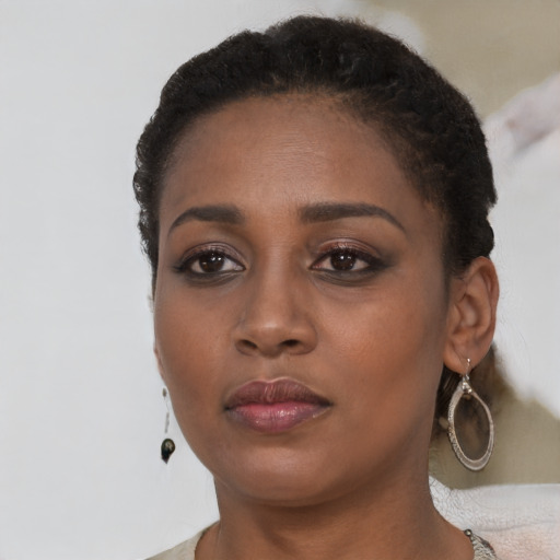 Neutral black young-adult female with short  brown hair and brown eyes