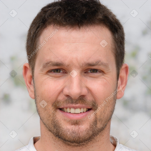 Joyful white adult male with short  brown hair and brown eyes