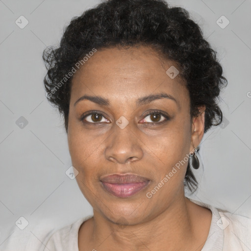 Joyful black adult female with short  brown hair and brown eyes