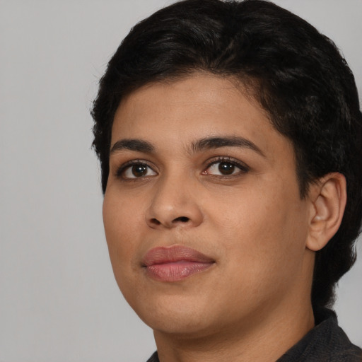 Neutral latino young-adult female with short  black hair and brown eyes