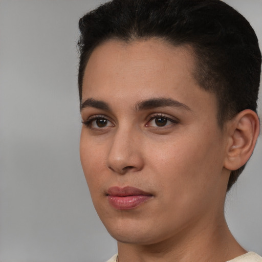 Joyful white young-adult female with short  brown hair and brown eyes