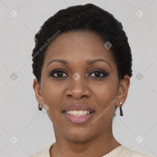 Joyful black young-adult female with short  black hair and brown eyes