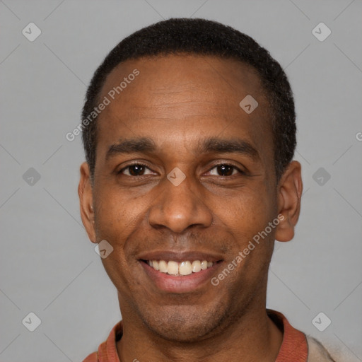 Joyful latino adult male with short  black hair and brown eyes
