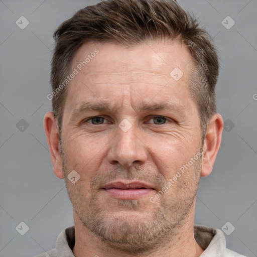 Joyful white adult male with short  brown hair and grey eyes