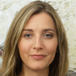 Joyful white young-adult female with long  brown hair and green eyes