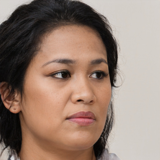 Neutral latino young-adult female with long  brown hair and brown eyes