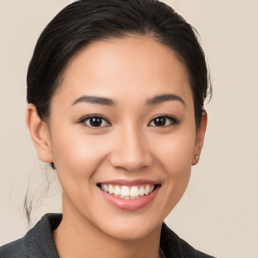 Joyful white young-adult female with medium  brown hair and brown eyes