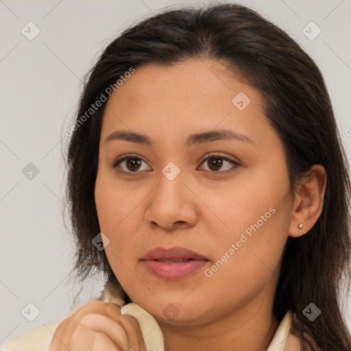 Joyful latino young-adult female with long  brown hair and brown eyes