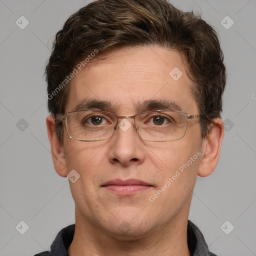 Joyful white adult male with short  brown hair and grey eyes