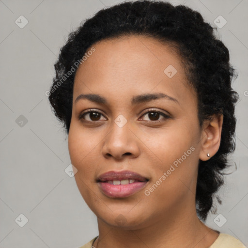 Joyful latino young-adult female with long  black hair and brown eyes