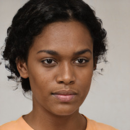 Neutral black young-adult female with short  brown hair and brown eyes