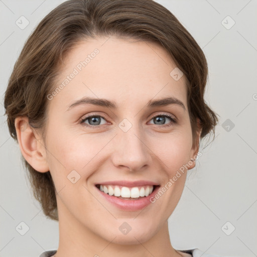 Joyful white young-adult female with medium  brown hair and grey eyes