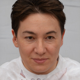 Joyful white adult female with short  brown hair and brown eyes