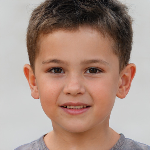 Joyful white child male with short  brown hair and brown eyes