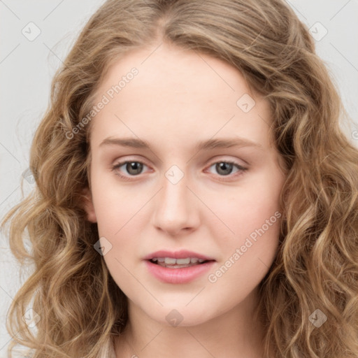 Joyful white young-adult female with long  brown hair and green eyes