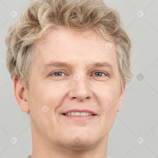 Joyful white adult male with short  brown hair and grey eyes