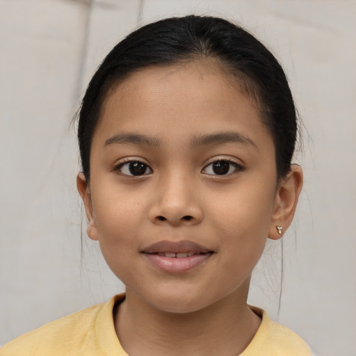 Joyful asian child female with short  brown hair and brown eyes