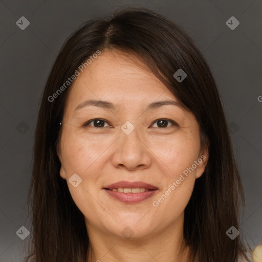 Joyful white adult female with long  brown hair and brown eyes