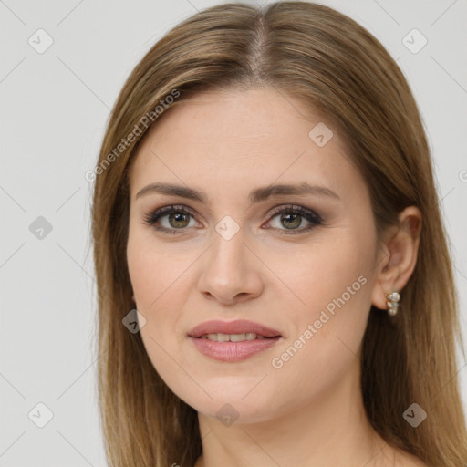 Joyful white young-adult female with long  brown hair and brown eyes