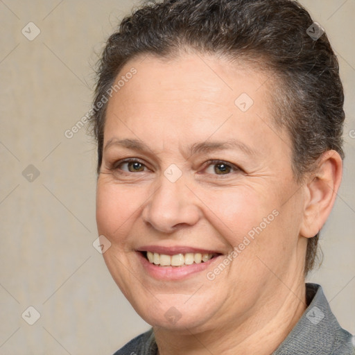 Joyful white adult female with short  brown hair and brown eyes