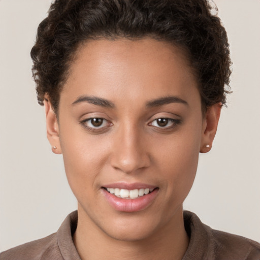 Joyful white young-adult female with short  brown hair and brown eyes