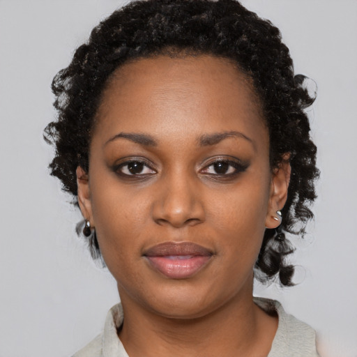 Neutral black young-adult female with short  black hair and brown eyes