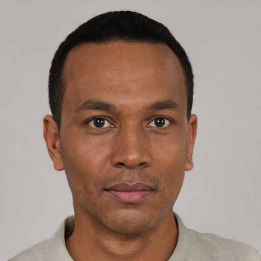 Neutral black young-adult male with short  black hair and brown eyes