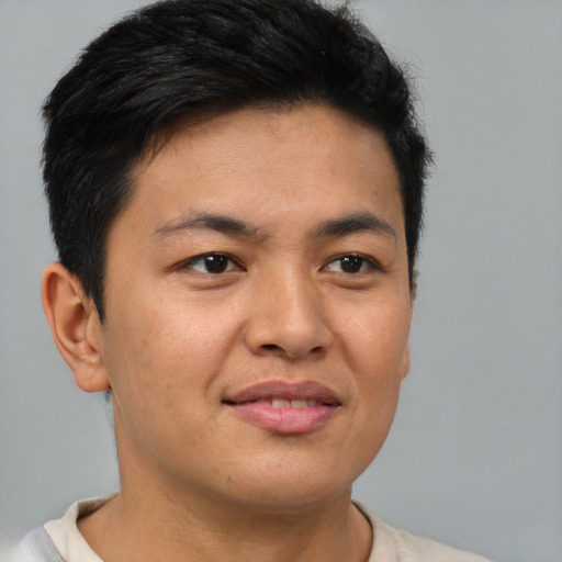 Joyful asian young-adult male with short  brown hair and brown eyes