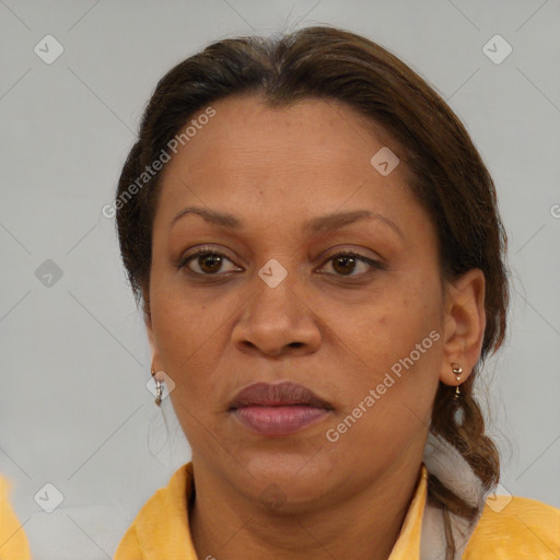 Joyful black adult female with short  brown hair and brown eyes