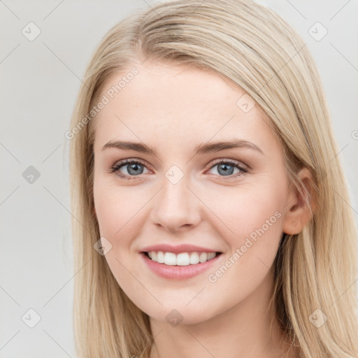 Joyful white young-adult female with long  brown hair and blue eyes