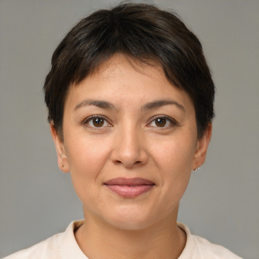 Joyful white young-adult female with short  brown hair and brown eyes
