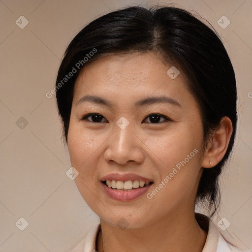 Joyful asian young-adult female with medium  brown hair and brown eyes