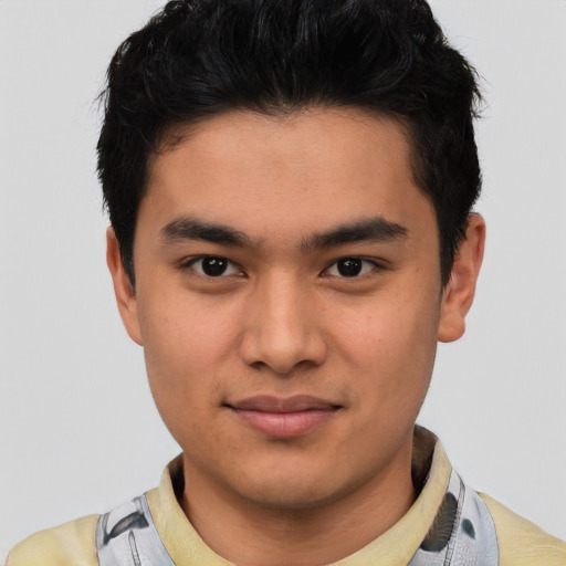 Joyful asian young-adult male with short  brown hair and brown eyes