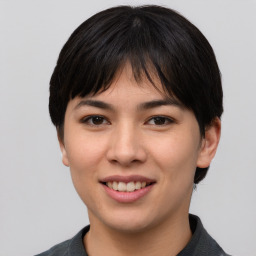 Joyful asian young-adult female with short  brown hair and brown eyes