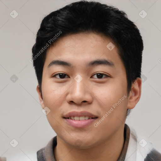 Joyful asian young-adult male with short  black hair and brown eyes