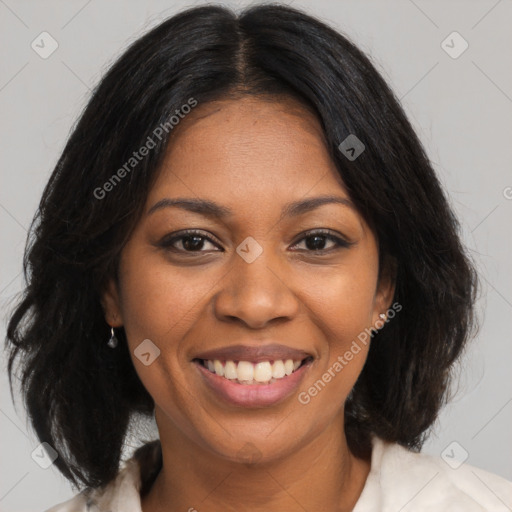 Joyful black young-adult female with medium  brown hair and brown eyes