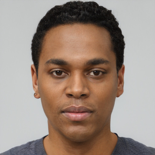 Neutral black young-adult male with short  black hair and brown eyes