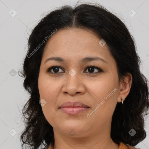 Joyful latino adult female with medium  brown hair and brown eyes