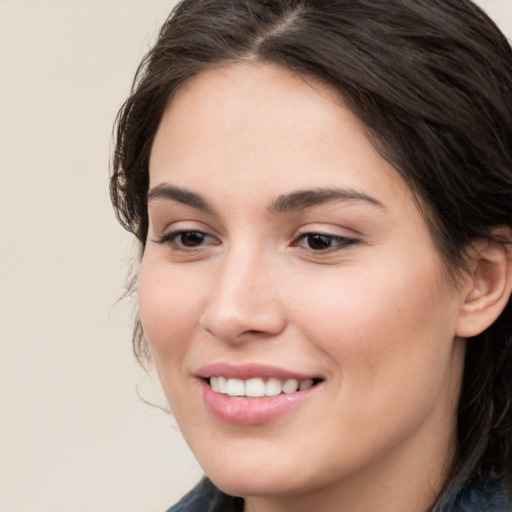 Joyful white young-adult female with medium  brown hair and brown eyes