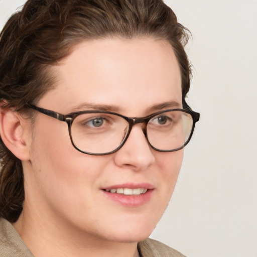 Joyful white young-adult female with medium  brown hair and blue eyes