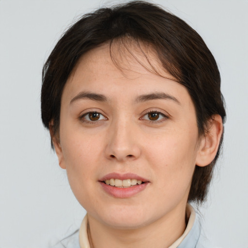 Joyful white young-adult female with medium  brown hair and brown eyes