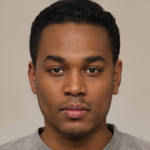 Neutral black young-adult male with short  black hair and brown eyes