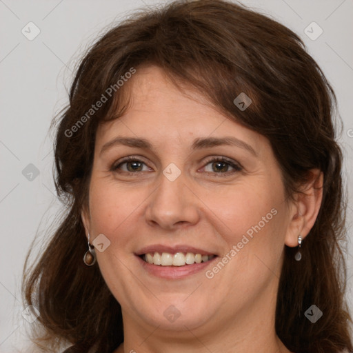 Joyful white adult female with medium  brown hair and grey eyes