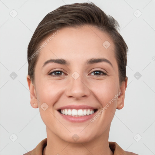 Joyful white young-adult female with short  brown hair and brown eyes