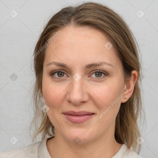 Joyful white adult female with medium  brown hair and grey eyes