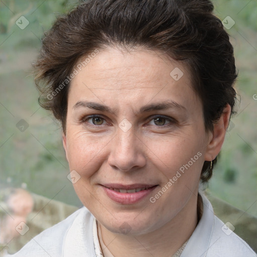 Joyful white adult female with short  brown hair and brown eyes