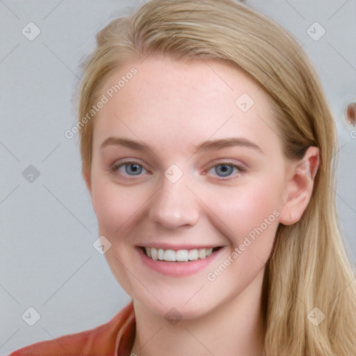 Joyful white young-adult female with long  brown hair and blue eyes