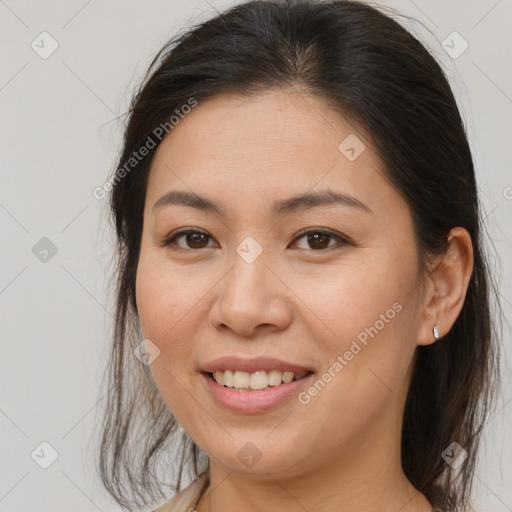 Joyful white young-adult female with medium  brown hair and brown eyes