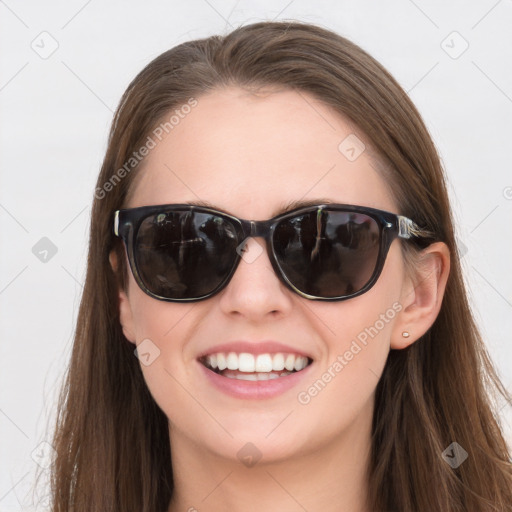 Joyful white young-adult female with long  brown hair and blue eyes