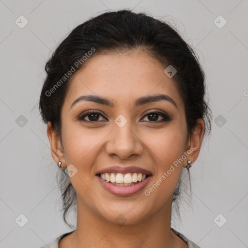 Joyful latino young-adult female with long  brown hair and brown eyes